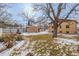 Large backyard with a tree, fence, and small shed at 3780 Benton St, Wheat Ridge, CO 80212