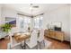 Dining room with hardwood floors and a modern wooden table at 3780 Benton St, Wheat Ridge, CO 80212