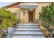 Steps leading to the front entrance of a brick home at 3780 Benton St, Wheat Ridge, CO 80212