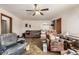 Living room with hardwood floors and furniture, in need of updating at 3780 Benton St, Wheat Ridge, CO 80212