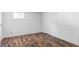 Basement boasts durable wood-look flooring, neutral walls, and a practical layout, ready for your personal touch at 1025 E Iowa Ave, Denver, CO 80210