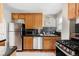 Charming kitchen with stainless steel appliances, granite countertops, and ample cabinet space at 1025 E Iowa Ave, Denver, CO 80210