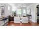 Bright living room with hardwood floors and modern décor that creates a welcoming ambiance at 1025 E Iowa Ave, Denver, CO 80210