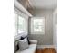 Bright sitting area with bench, natural light, and neutral décor, perfect for relaxing and reading at 1025 E Iowa Ave, Denver, CO 80210