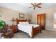 Bright bedroom featuring a wood bed frame and ample closet space at 317 Ingleton Ct, Castle Pines, CO 80108