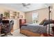 Bedroom with a desk setup and built-in shelving at 317 Ingleton Ct, Castle Pines, CO 80108