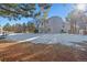 Two-story house exterior with snow-covered yard at 317 Ingleton Ct, Castle Pines, CO 80108