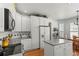 White kitchen with stainless steel appliances and ample counter space at 317 Ingleton Ct, Castle Pines, CO 80108