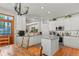 Bright kitchen with an island, stainless steel appliances, and white cabinets at 317 Ingleton Ct, Castle Pines, CO 80108