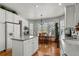 Eat-in kitchen with white cabinets and granite countertops at 317 Ingleton Ct, Castle Pines, CO 80108