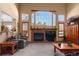 Living room with a brick fireplace and vaulted ceilings at 317 Ingleton Ct, Castle Pines, CO 80108