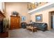 Two-story living room with a fireplace and lots of natural light at 317 Ingleton Ct, Castle Pines, CO 80108