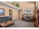 Open living room with a view into the kitchen and high ceilings at 317 Ingleton Ct, Castle Pines, CO 80108