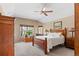 Main bedroom with wood furniture and ceiling fan at 317 Ingleton Ct, Castle Pines, CO 80108