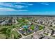 Enjoy aerial views of this neighborhood featuring green spaces, pools, and well-maintained homes at 14116 Double Dutch Cir, Parker, CO 80134