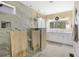Bright bathroom featuring a glass-enclosed shower and double vanity with marble countertops at 14116 Double Dutch Cir, Parker, CO 80134