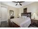 Cozy bedroom with a queen-sized bed, ornate bedside tables, and ample natural light at 14116 Double Dutch Cir, Parker, CO 80134
