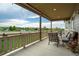 Enjoy outdoor living on this covered patio with comfortable seating and neighborhood views at 14116 Double Dutch Cir, Parker, CO 80134