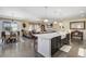 Spacious kitchen with a central island and open layout seamlessly connecting to the living area at 14116 Double Dutch Cir, Parker, CO 80134