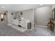 Basement kitchenette featuring white cabinetry, countertop space, and modern appliances at 14116 Double Dutch Cir, Parker, CO 80134