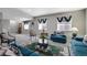 Comfortable living room with neutral walls, stylish decor, and plenty of natural light at 14116 Double Dutch Cir, Parker, CO 80134