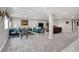 Spacious living room with plush carpeting and ample seating, perfect for entertaining and relaxing at 14116 Double Dutch Cir, Parker, CO 80134