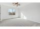 Bright bedroom with a ceiling fan and a large window offering natural light at 9057 Bermuda Run Cir, Highlands Ranch, CO 80130