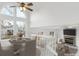 Dining room with a high ceiling, large windows and a view to the fireplace at 9057 Bermuda Run Cir, Highlands Ranch, CO 80130