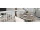 Dining area with table set for a meal, looking down onto the living room at 9057 Bermuda Run Cir, Highlands Ranch, CO 80130