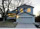 Two-story home with a well-maintained front yard and a two-car garage at 9057 Bermuda Run Cir, Highlands Ranch, CO 80130