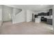 Open-concept kitchen flows seamlessly into the living area, showcasing the home's inviting layout at 5550 Malta St, Denver, CO 80249
