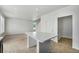 Kitchen with bright walls, showcasing modern island, appliances, and open floorplan at 5550 Malta St, Denver, CO 80249