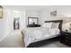 Comfortable bedroom with a large bed, dresser, and a spacious walk-in closet at 8520 S Holland Ln # 102, Littleton, CO 80128