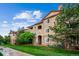Attractive condo with stone accents, balconies, and well-maintained landscaping at 8520 S Holland Ln # 102, Littleton, CO 80128
