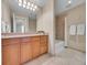 Clean bathroom with tub and wood vanity at 2200 S University Blvd # 511, Denver, CO 80210