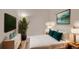 Bright bedroom with a queen-size bed and TV at 2200 S University Blvd # 511, Denver, CO 80210