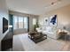 Living Room with large windows and comfy couch at 2200 S University Blvd # 511, Denver, CO 80210