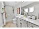 Modern bathroom featuring a glass door shower, sleek vanity, and neutral color palette at 3178 N Race St, Denver, CO 80205