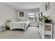 Bright bedroom with neutral carpet, large window, and decorative accents, offering a cozy and inviting atmosphere at 3178 N Race St, Denver, CO 80205