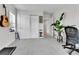 Bright room with white closet doors, decor, home office setup, and an accent plant at 3178 N Race St, Denver, CO 80205