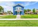 Charming blue two-story home with well-manicured lawn and inviting front porch at 3178 N Race St, Denver, CO 80205