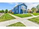 Stylish blue home with a well-kept lawn and a welcoming walkway to the front door at 3178 N Race St, Denver, CO 80205