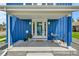 Inviting front porch with seating area and attractive blue siding detail at 3178 N Race St, Denver, CO 80205