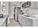 Modern kitchen with stainless steel appliances and grey cabinets and white countertop at 3178 N Race St, Denver, CO 80205