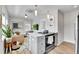 Open concept kitchen, living room, and dining room with modern decor and natural lighting at 3178 N Race St, Denver, CO 80205