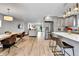 Open concept living space featuring modern kitchen, dining area, and living room with hardwood floors throughout at 3178 N Race St, Denver, CO 80205