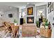 Cozy living room with a fireplace, stylish furnishings, and ample natural light at 3178 N Race St, Denver, CO 80205