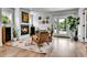 Bright living room featuring a fireplace, modern decor, and access to the outdoors at 3178 N Race St, Denver, CO 80205