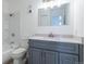 Modern bathroom with sleek vanity, updated fixtures, and a shower-tub combination for relaxation at 5995 W Hampden Ave # 17C, Denver, CO 80227