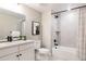 Clean bathroom with bathtub, shower, and white vanity at 10270 E 62Nd Pl, Denver, CO 80238